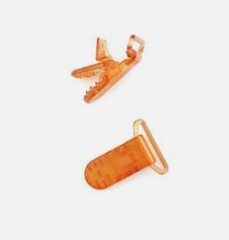 PINZA CHUPETERO PLASTICO TRANSPARENTE NARANJA